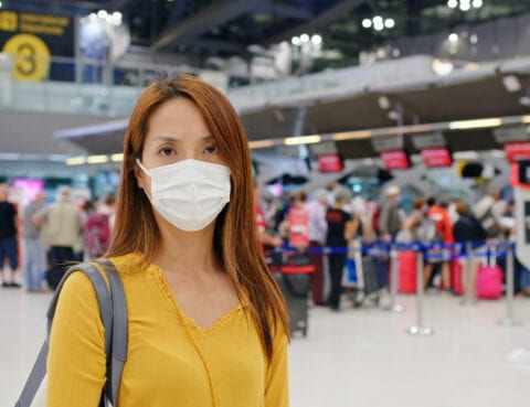 lady with face mask at airport